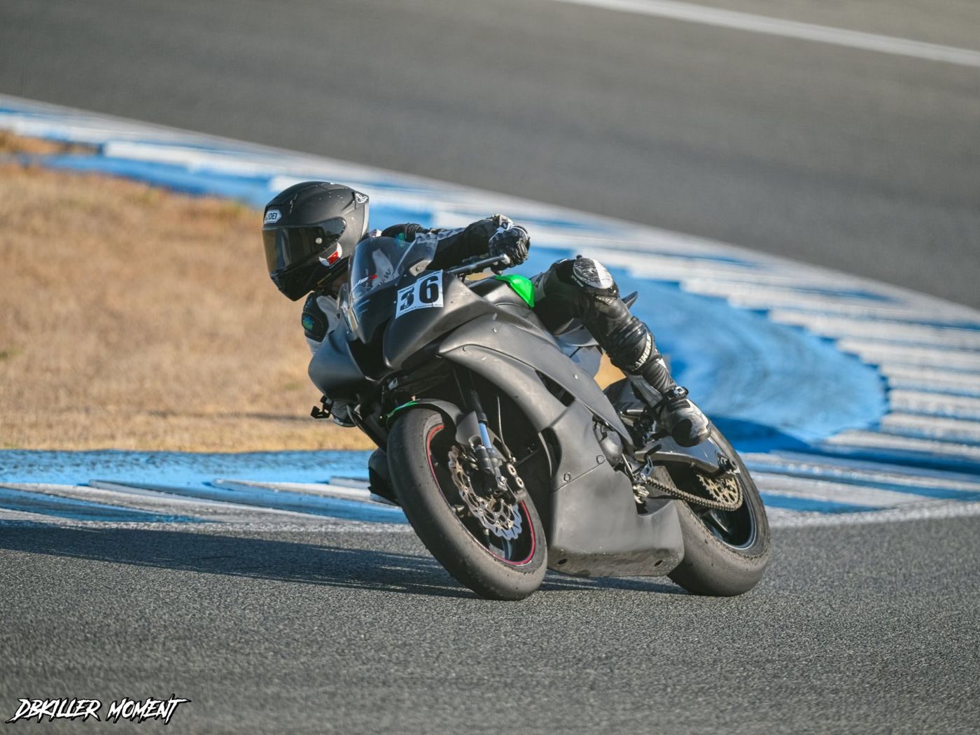 Josh leaning into a corner on his black R6, number 36 on the fairing.